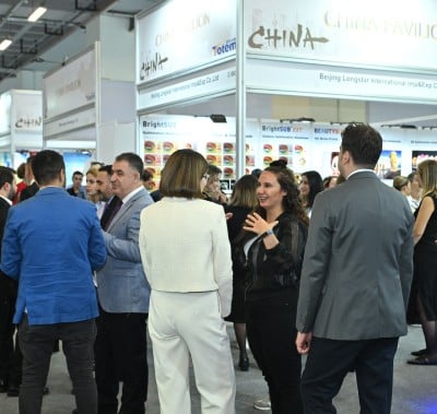 team is networking at PROMOGIFT exploring business opportunities discussing promotional products